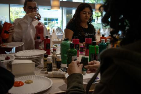 Students using paint supplies