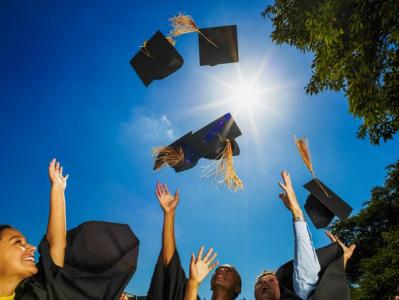 Students Throwing Caps In Air